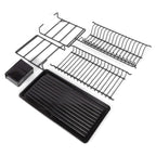 Black dish rack components laid out with the drip tray and cutlery holder