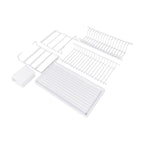 White dish rack components laid out with the drip tray and cutlery holder